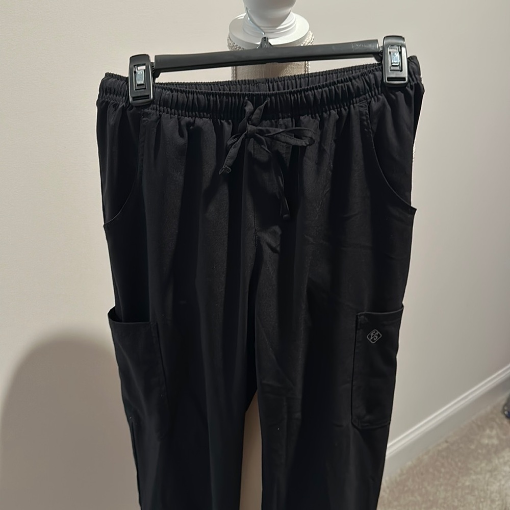 Woman’s black scrub bottoms.